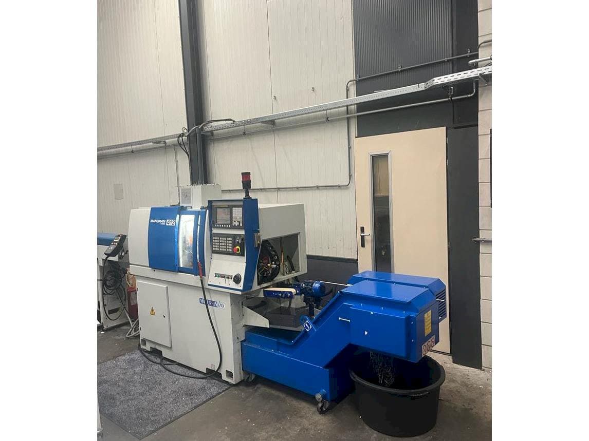 Vista frontal de la máquina Manurhin K'MX 413