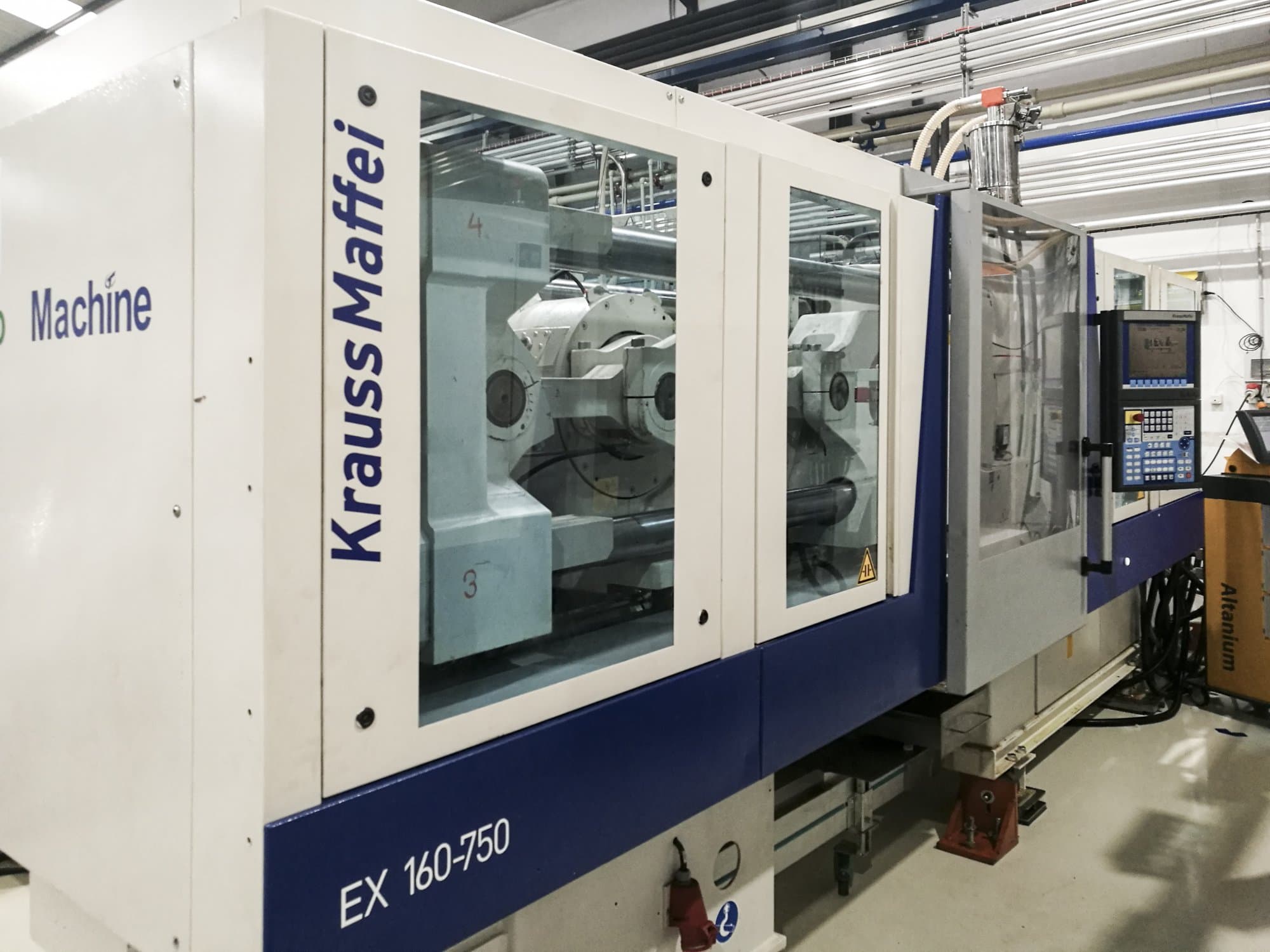 Vista izquierda de la máquina Krauss Maffei 160-750 EX