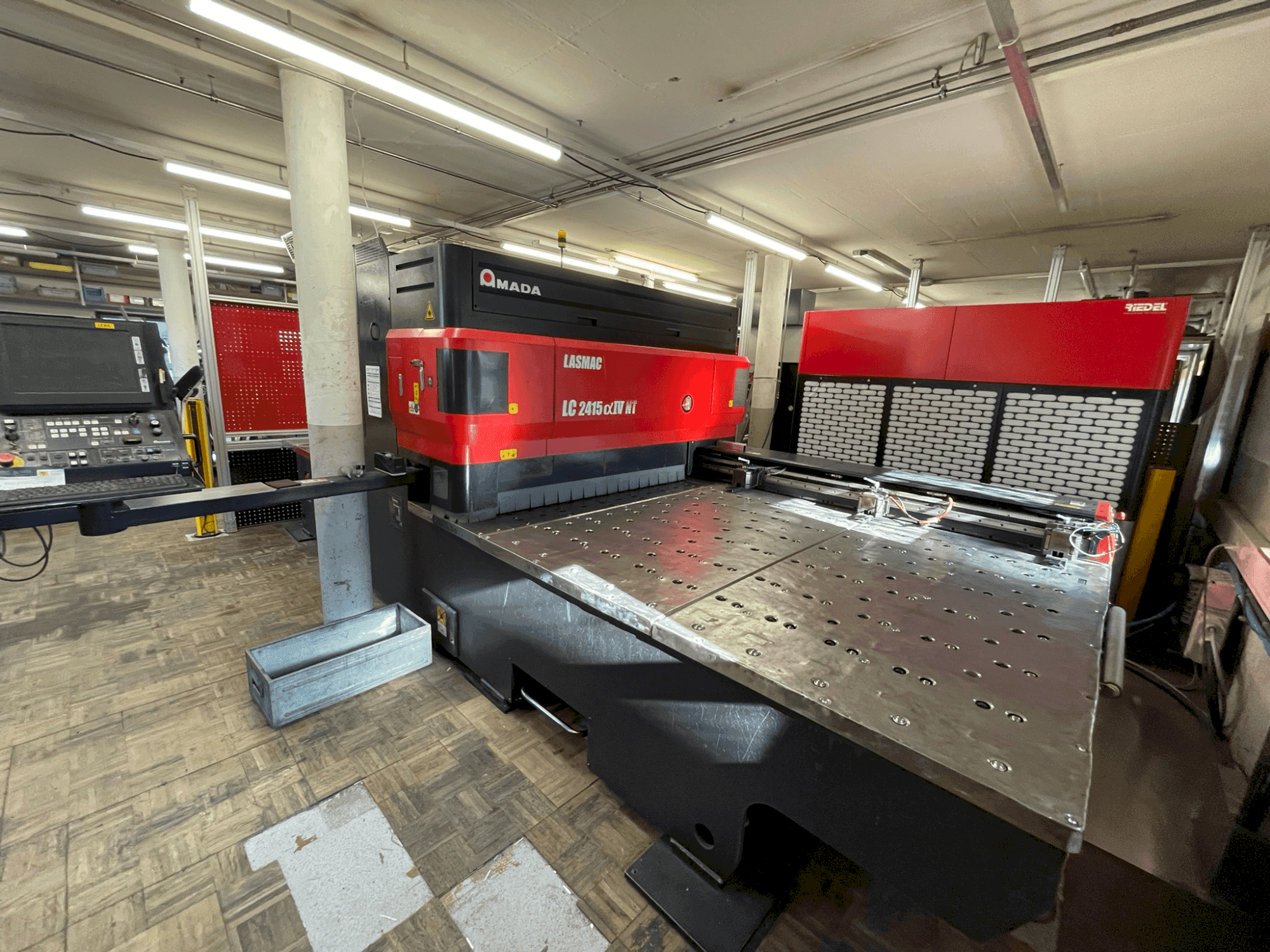 Front view of AMADA LC 2415 α-IV NT machine