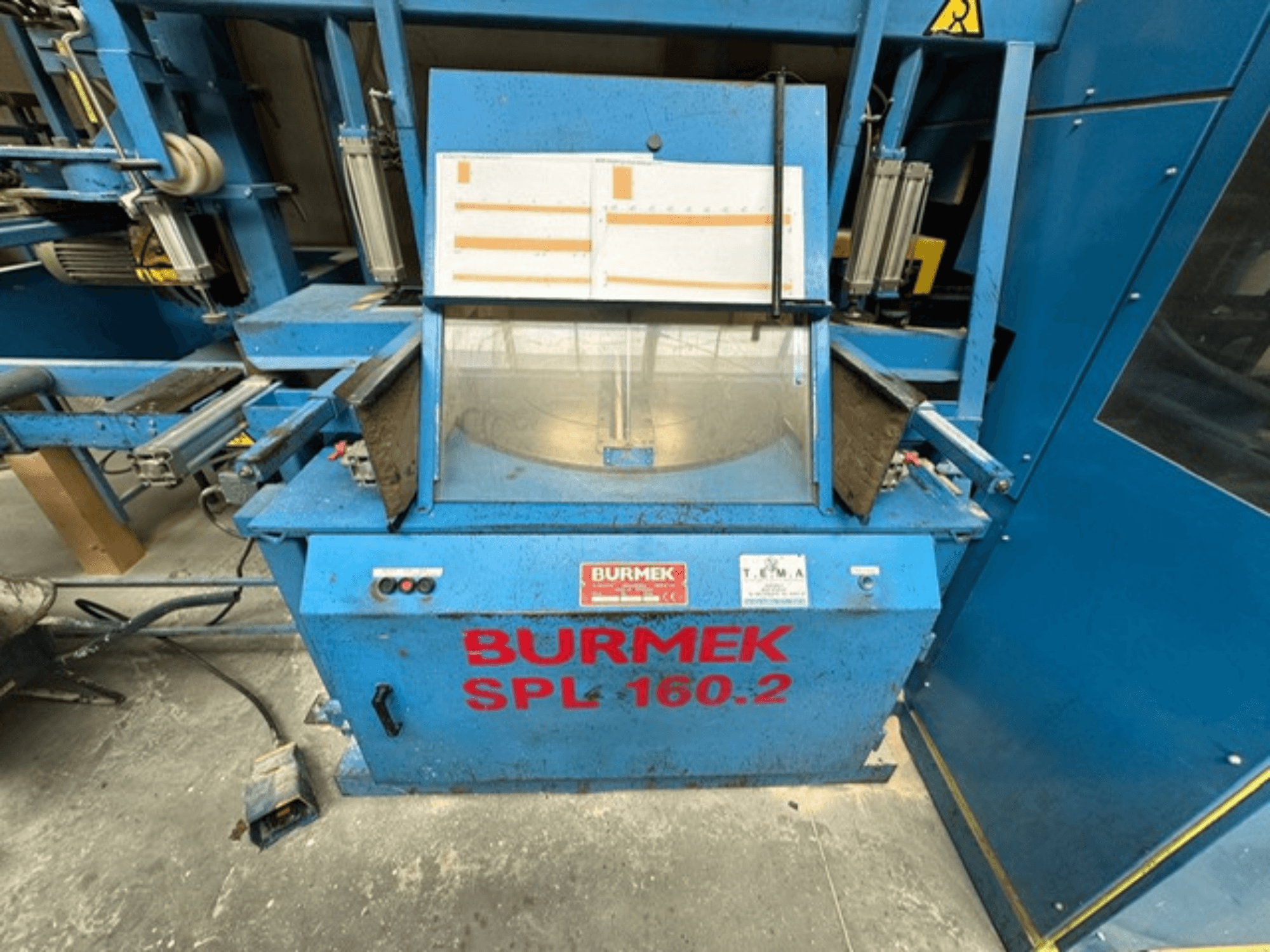 Máquina de madera BURMEK SPL 160.2 azul, vista frontal, con botones de control y un panel de cristal que muestra el interior.