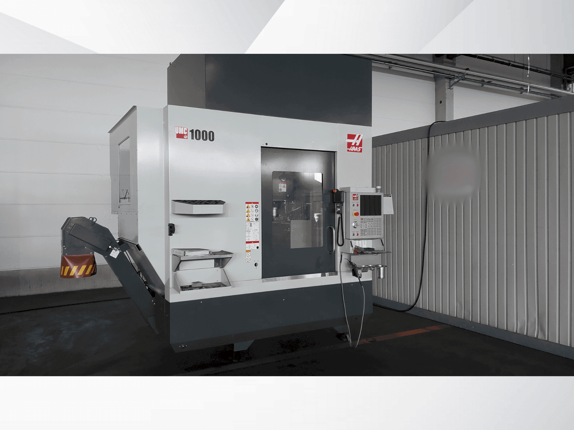 Front view of HAAS UMC 1000 machine