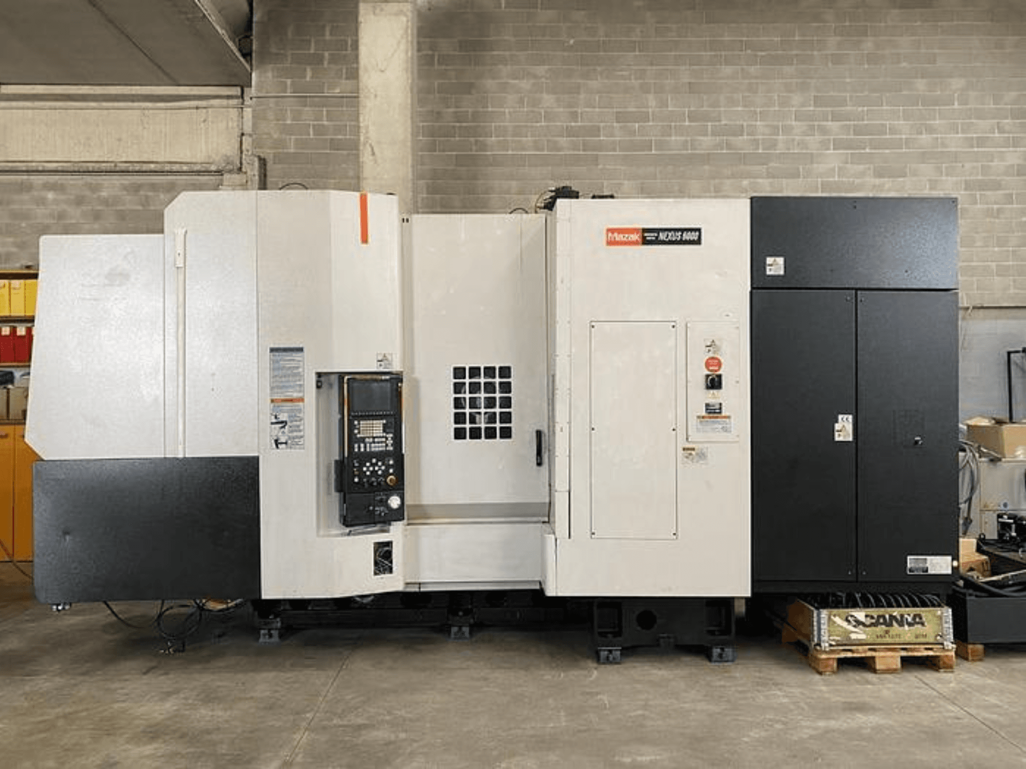 Mazak NEXUS 6400 CNC lathe, front view, featuring control panel, power switch, and two-tone white and black housing.