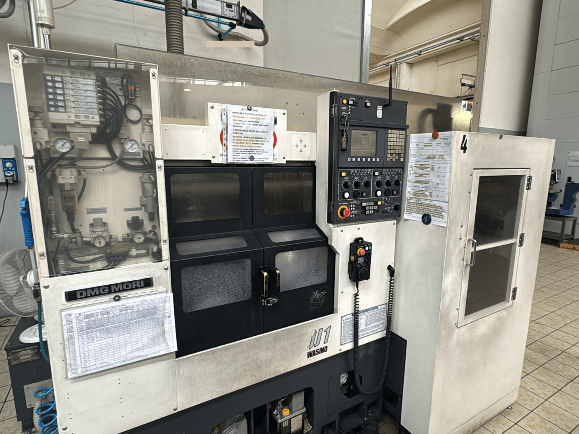 DMG Mori JD1 CNC machine, front view, with control panel and operation details displayed, industrial setting.