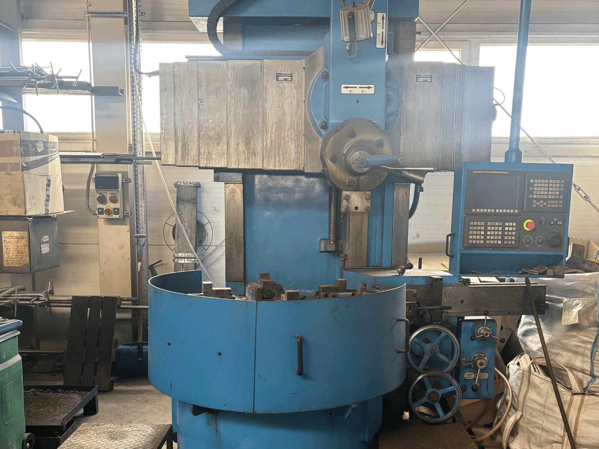 Industrial milling machine from an unknown brand, front view, featuring a blue exterior and digital control panel.